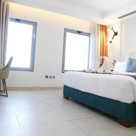 Waterfront Hotel Apartment Lusail Экстерьер фото A room at the hotel